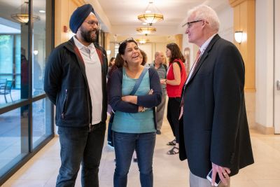 Baltej and Rupinder Singh of San Jose, California, meet Dean of Admission Rick Shaw while they wait at Parents' Check-In at the Arrillaga Alumni Center.