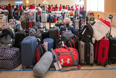 Luggage is kept at the Alumni Center until the prospective students set off for their dorm assignments.