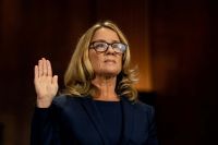 Christine Blasey Ford swears in at a Senate Judiciary Committee hearing for her to testify about sexual assault allegations against Supreme Court nominee Judge Brett M. Kavanaugh