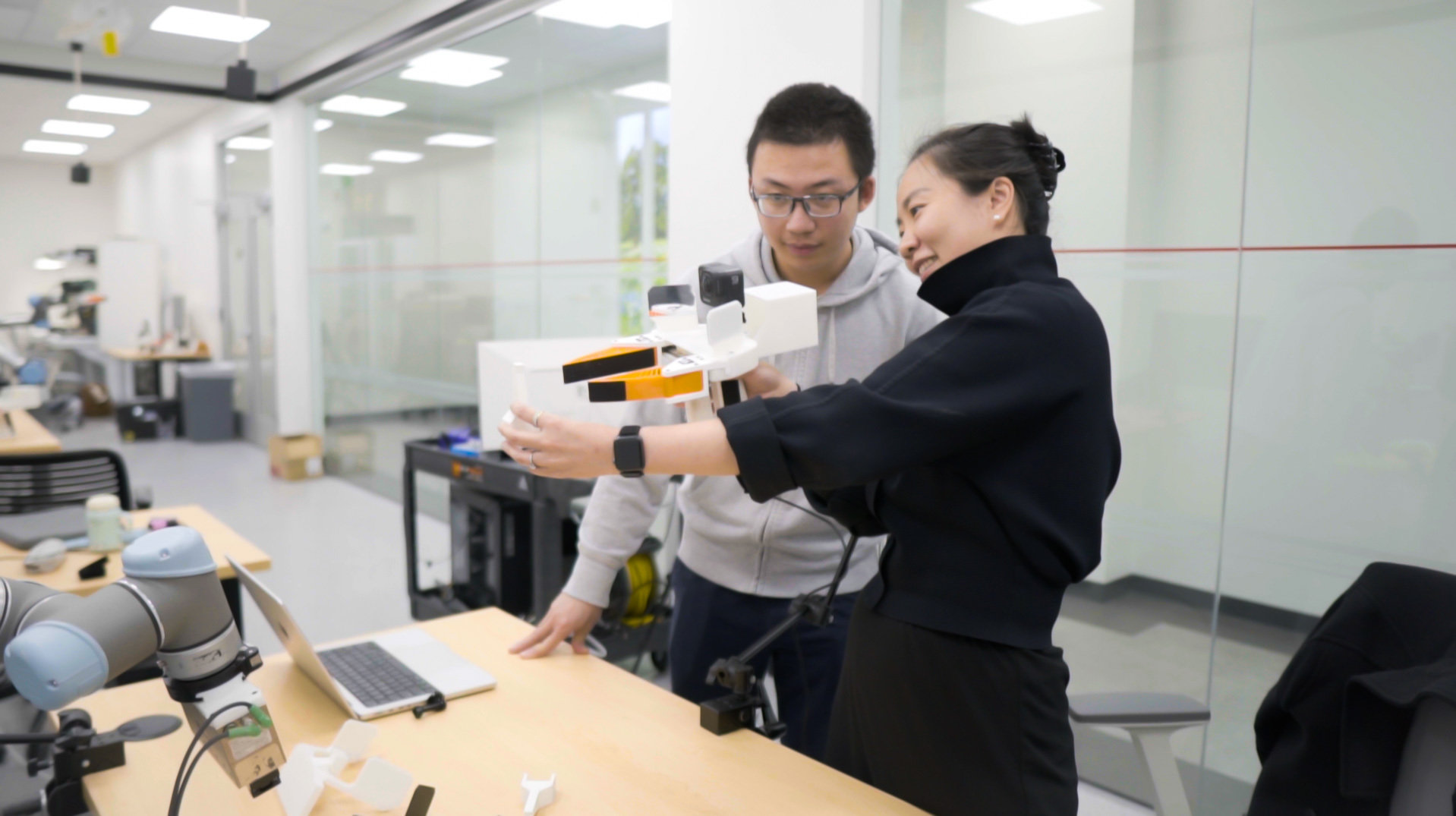 Researchers testing Universal Manipulation Interface gripper.