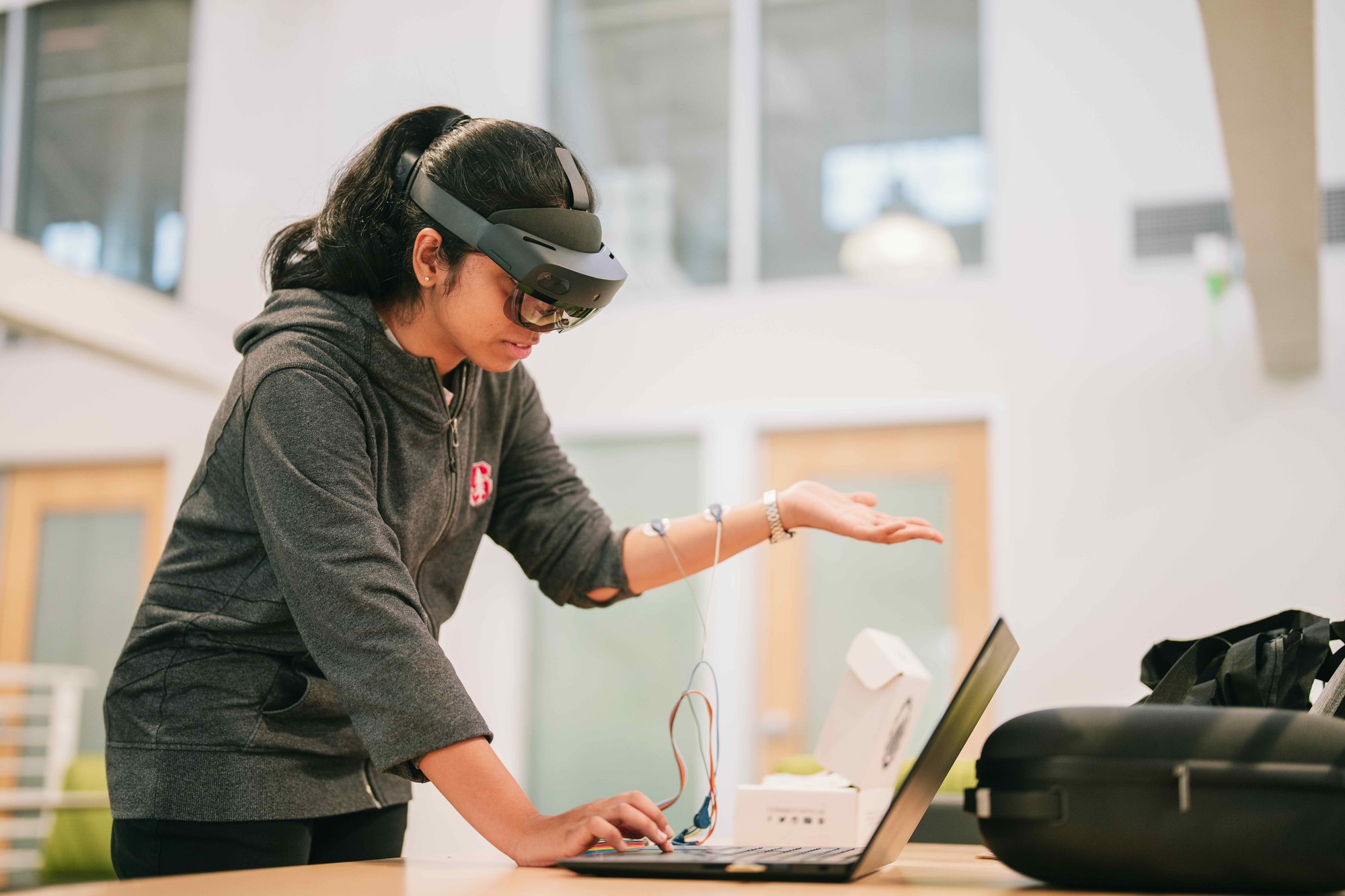 Researcher testing wearable sensors for prosthetics.