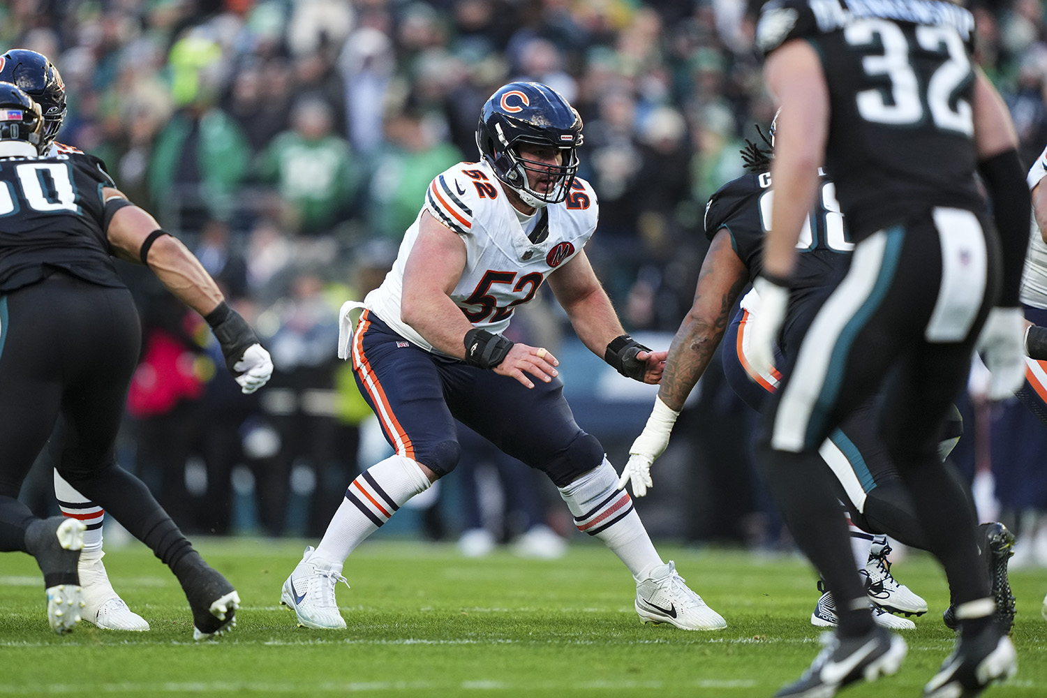 Drew Dalman #52 of the Chicago Bears drops back to block during an NFL football game against the Philadelphia Eagles at Lincoln Financial Field on November 28, 2025 in Philadelphia, Pennsylvania.