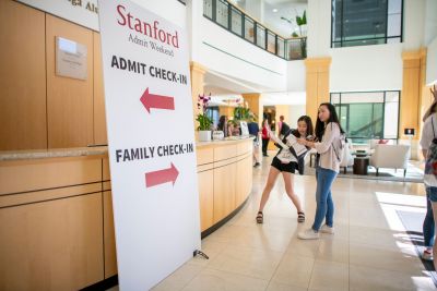 Admits Danielle Nam of Los Altos, California, and Michaela Phan of Portsmith, New Hampshire, plan their morning after checking in.