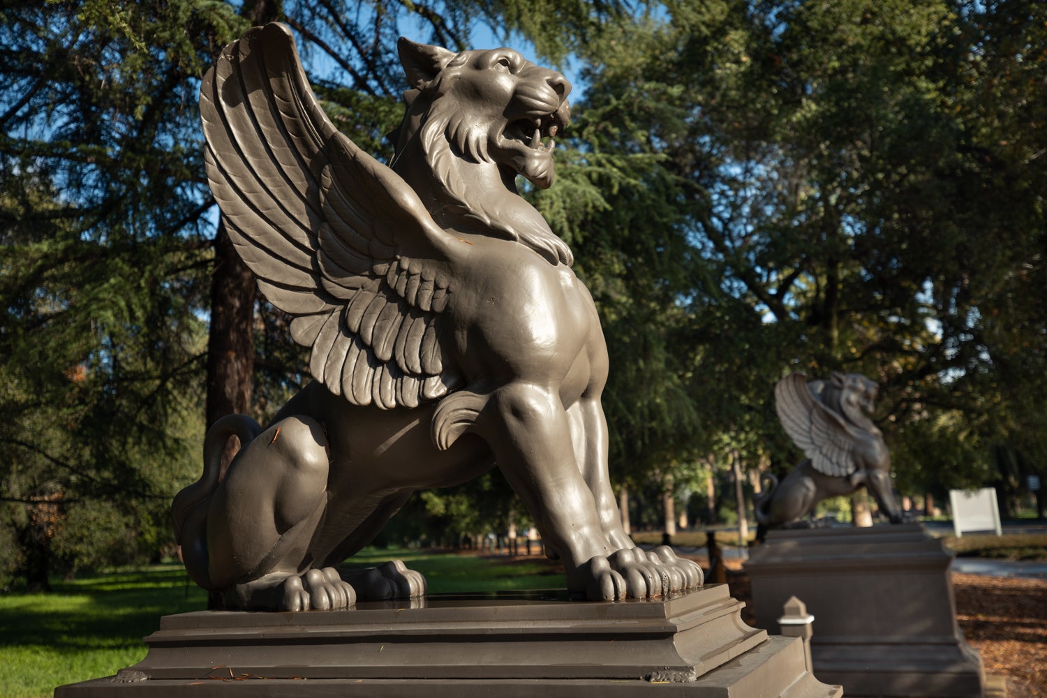 The two griffin statues, which are lions with eagle wings