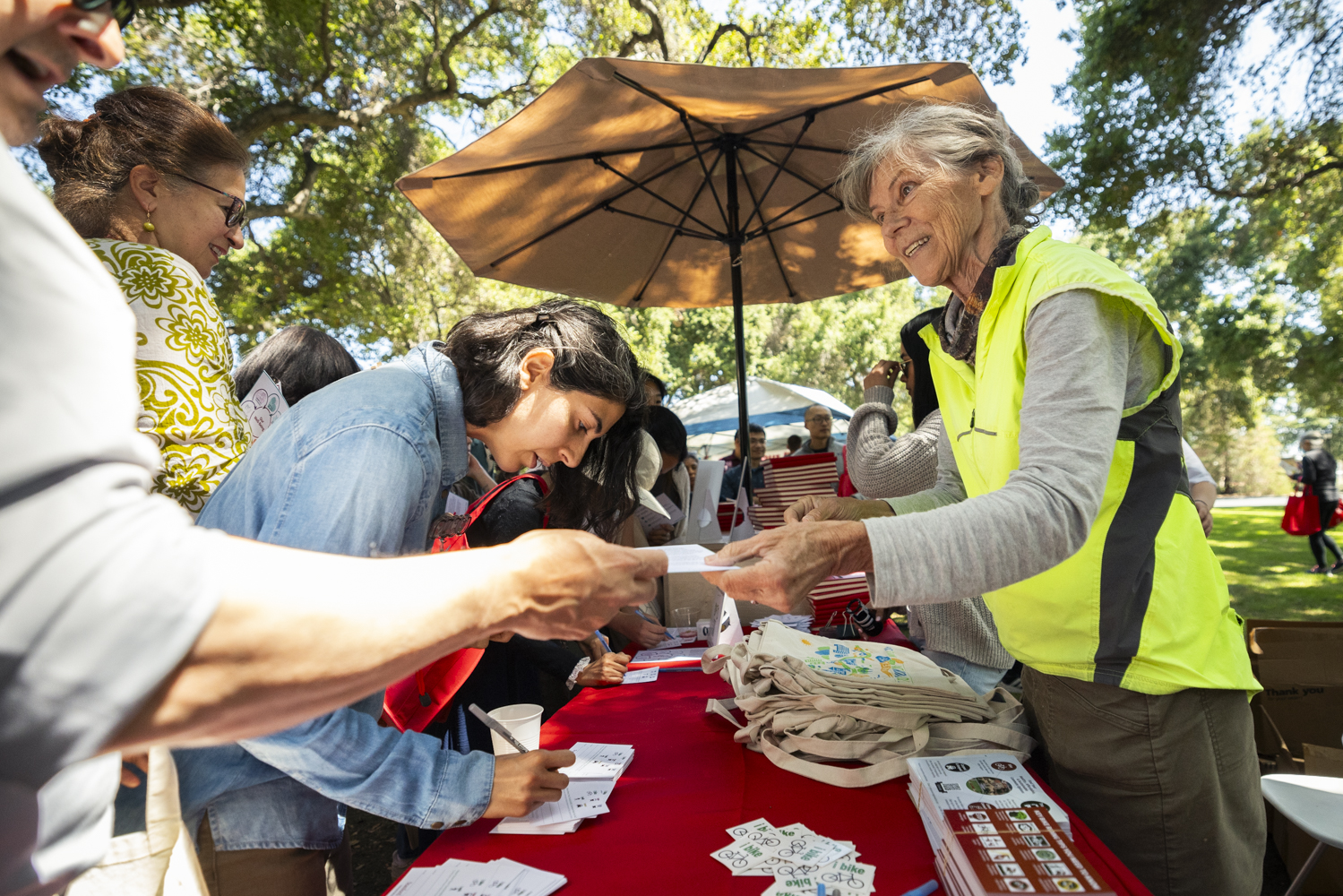 Staff from Stanford Transportation hand out fliers and tote bags at the Wellness Fair.