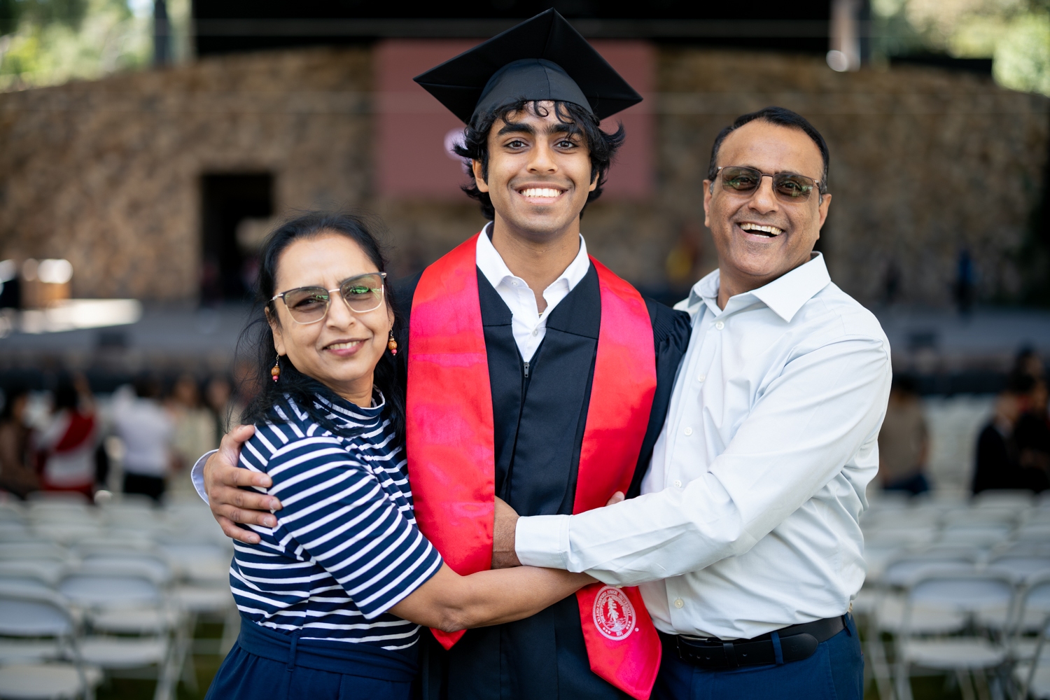 Proud parents beam with their grad