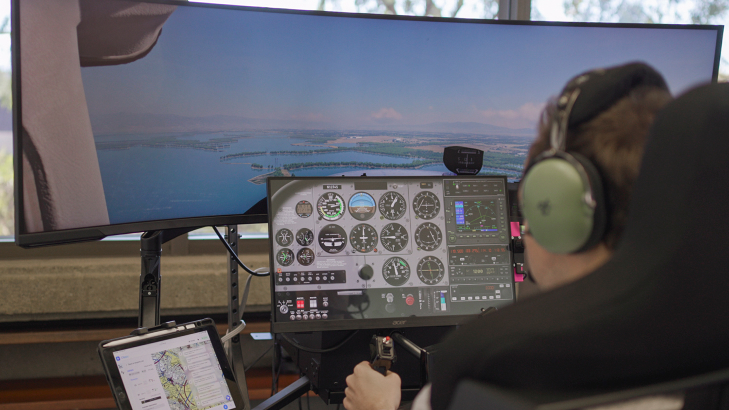 Image of a person using a flight simulator.