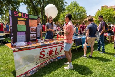 Students from the Stanford Society of Latinx Engineers meet with ProFros at the Activities Fair.