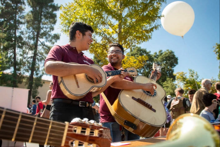 Eric Sosa-Lesso plays the vihuela and Joel Ramirez plays the guitarron