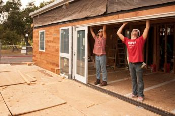 Students install the sliding doors on the start.home