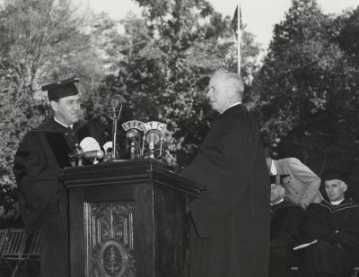 Wallace Sterling at the lectern with radio microphones to broadcast his inaugural address