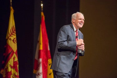 John Hennessy on stage of Memorial Auditorium