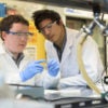 Stanford researchers Greg Pitner and Matt Abramian finalize sample preparation in the Neurofab, mounting the cell culture vessel to the suspended CNT wafer.