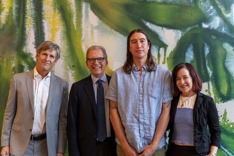 Photo of Mark Nicolls, Dean Minor, Saif Azzuz, and Deborah Cullinan standing in front of the mural.