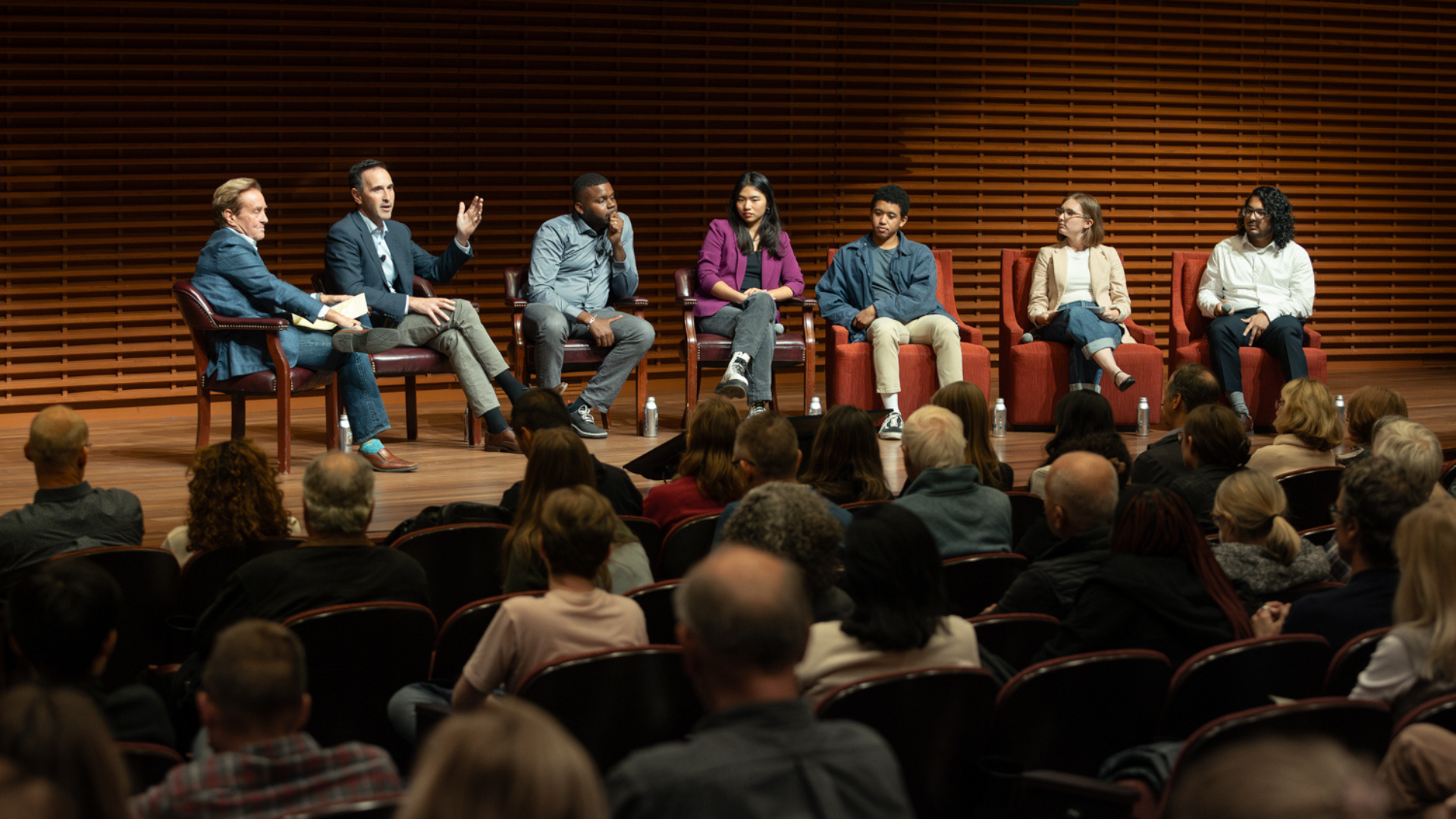 Speakers on stage for Continuing Studies Democracy class