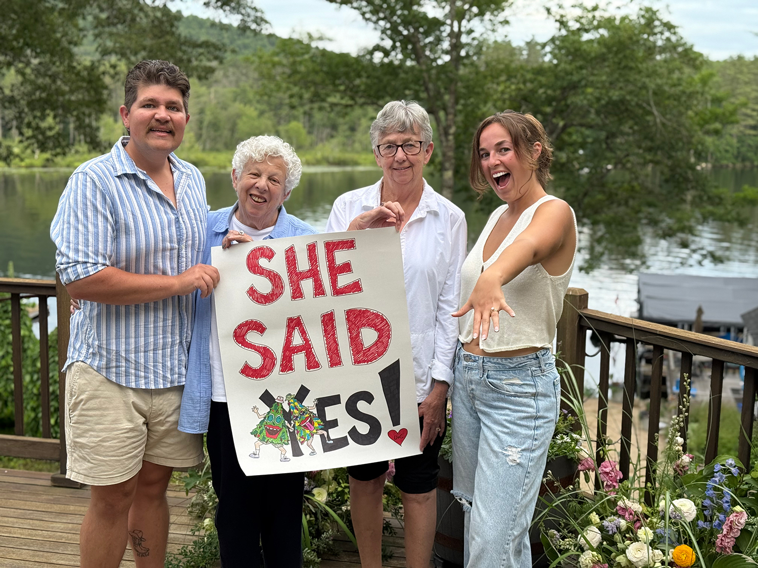 Image of Caroline Kushel and Dahkota Brown with family members after getting engaged.