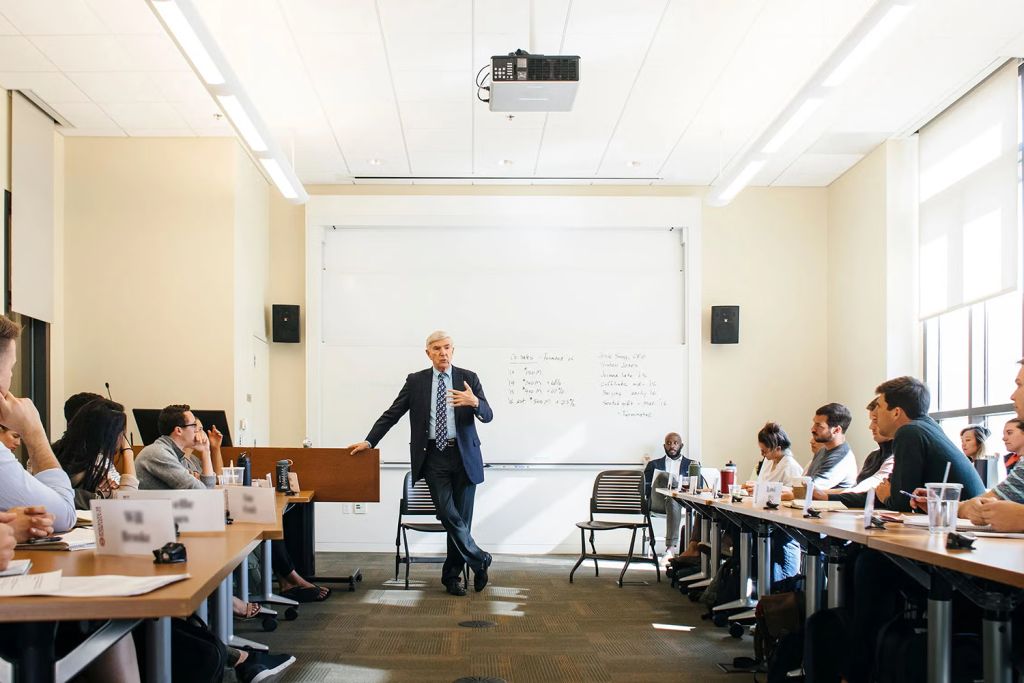 Image of H. Irving Grousbeck teaching a class of students.