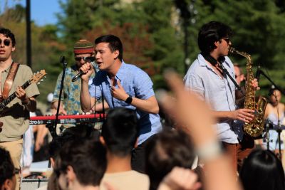 Lead singer, keyboardist and guitar player on stage