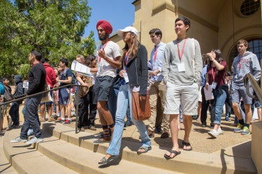 admitted students walking down steps of Memorial Auditorium