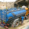 A tanker truck illegally takes water from a river in Jordan.