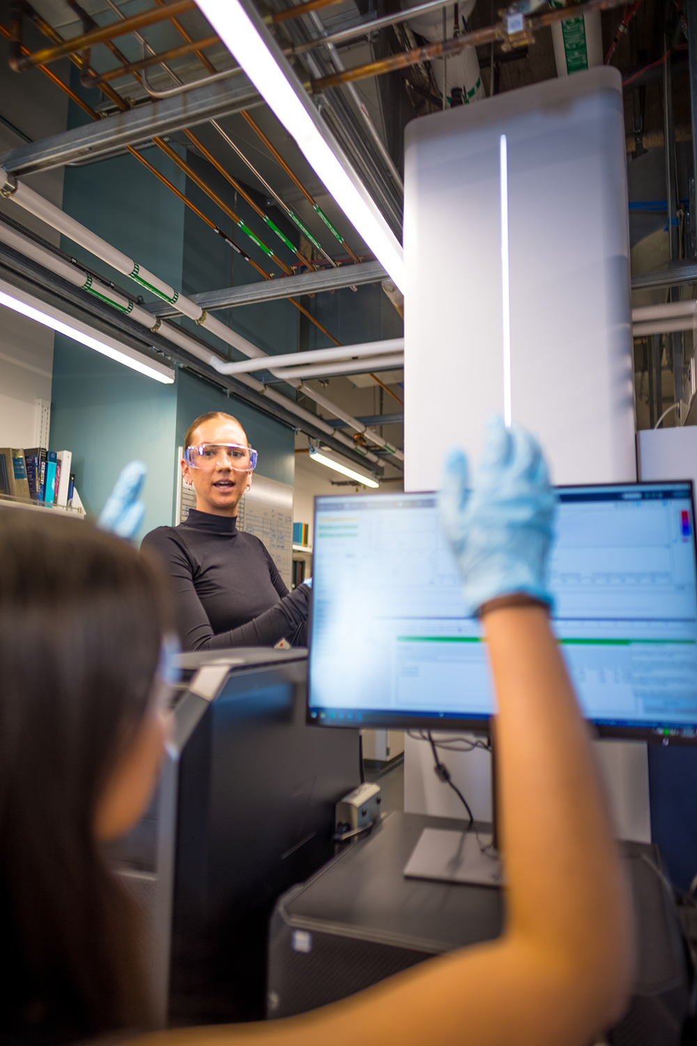 Casey Powers walks students through real-time data interpretation on the instrument.