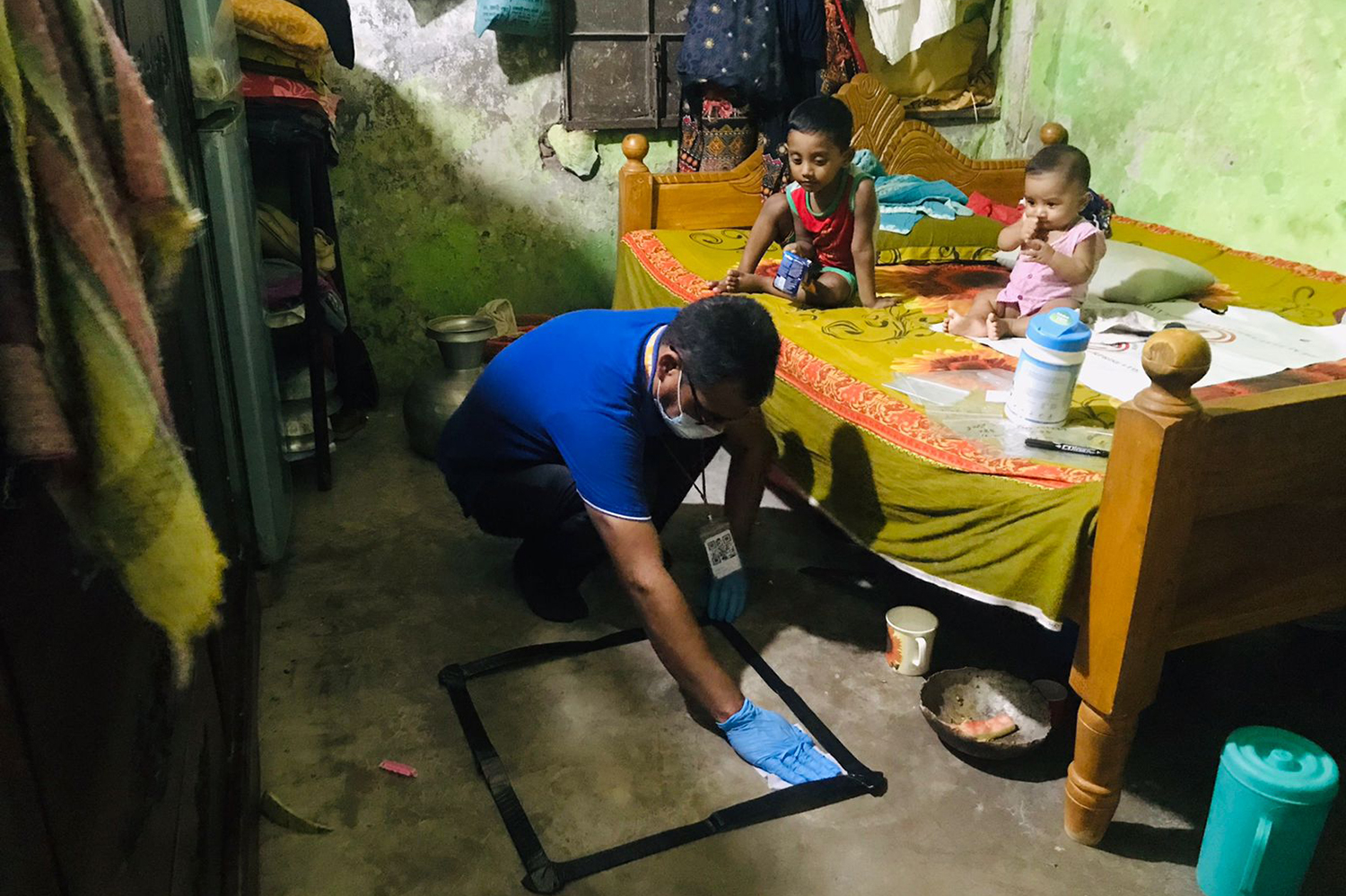 Image of a researcher collecting dust in a home in Mymensingh, Bangladesh, for lead analysis.