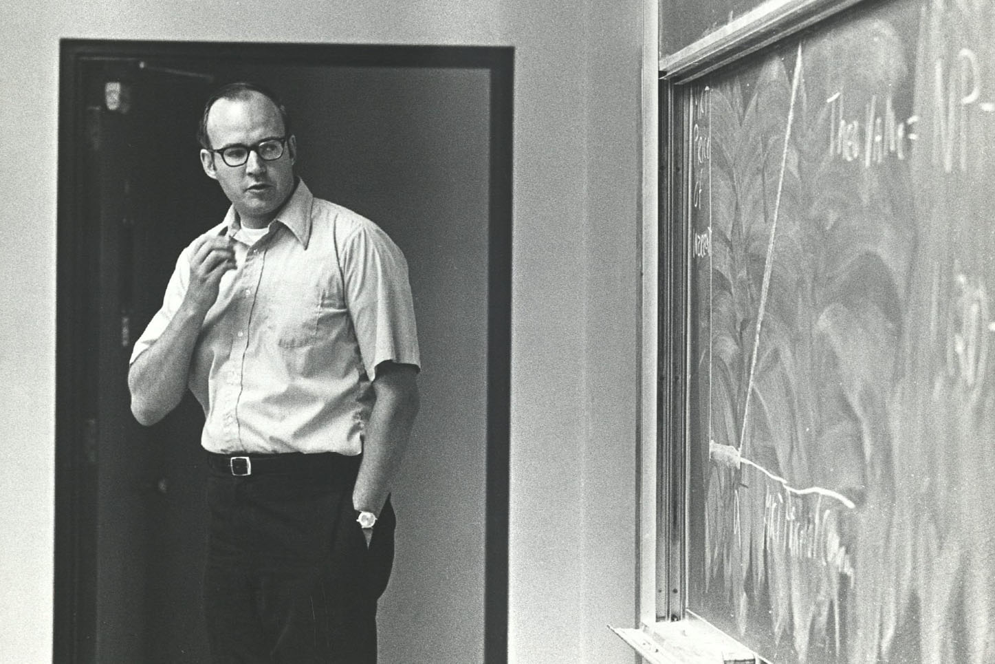 Photo of James Van Horne at a blackboard in the classroom.