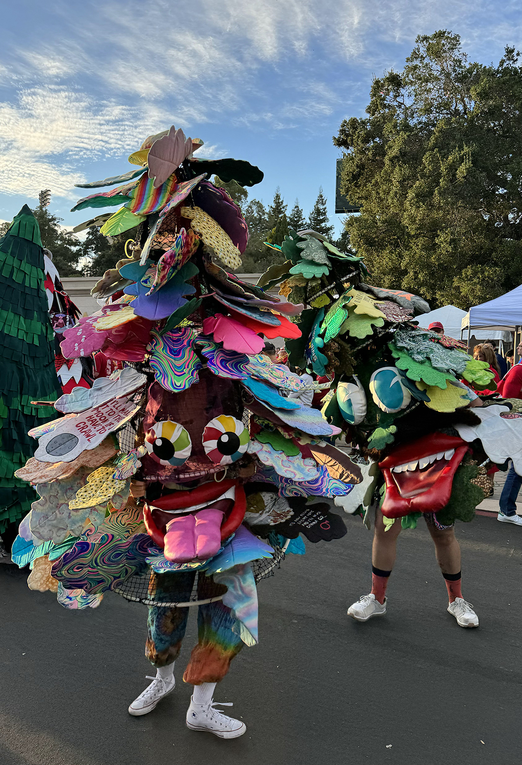 Image of Caroline Kushel and Dahkota Brown both in their Tree mascot outfits.