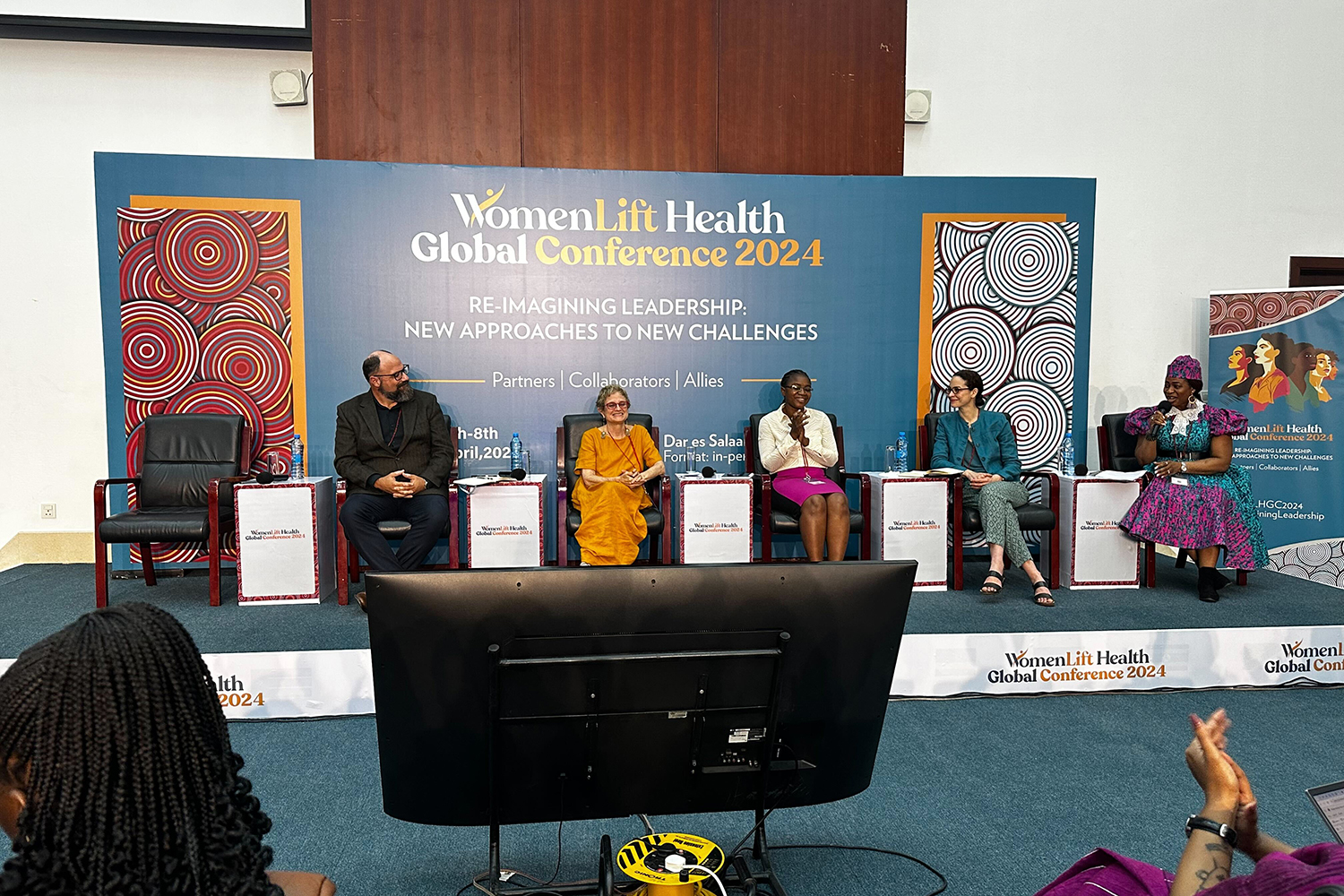 Panelists discuss leadership challenges at the WomenLift Health Global Conference 2024, emphasizing collaboration and innovative approaches.