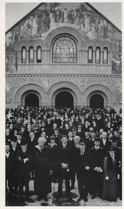 Crowd in front of Memorial Church with Ray Lyman Wilbur and other university dignitaries in front at Wilbur's inauguration