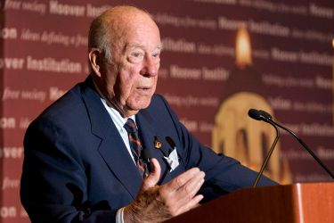 George Shultz at podium