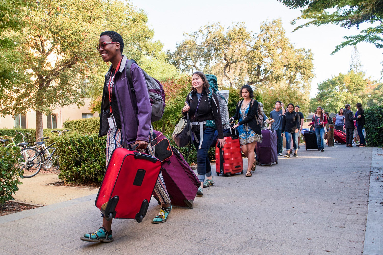 Some of the first students in line at FroSoCo make their way to the welcome table with their luggage in tow. Move-In Day. NSO 2016