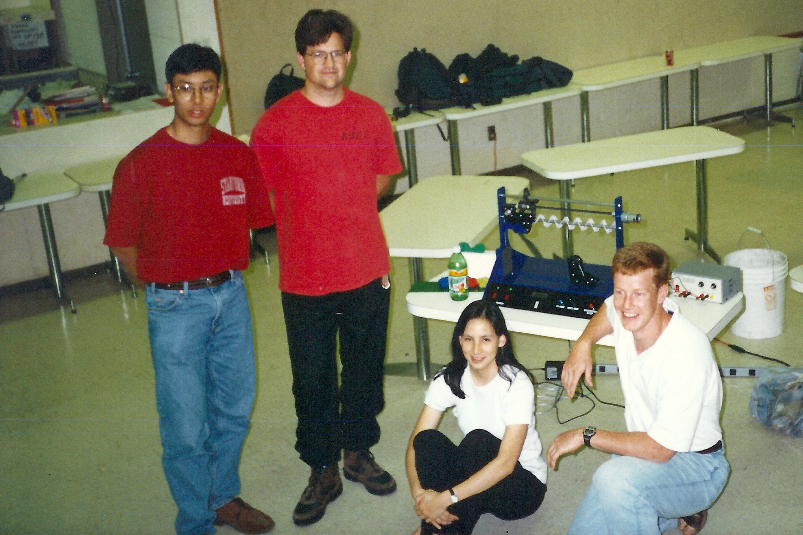 Two students standing and two sitting