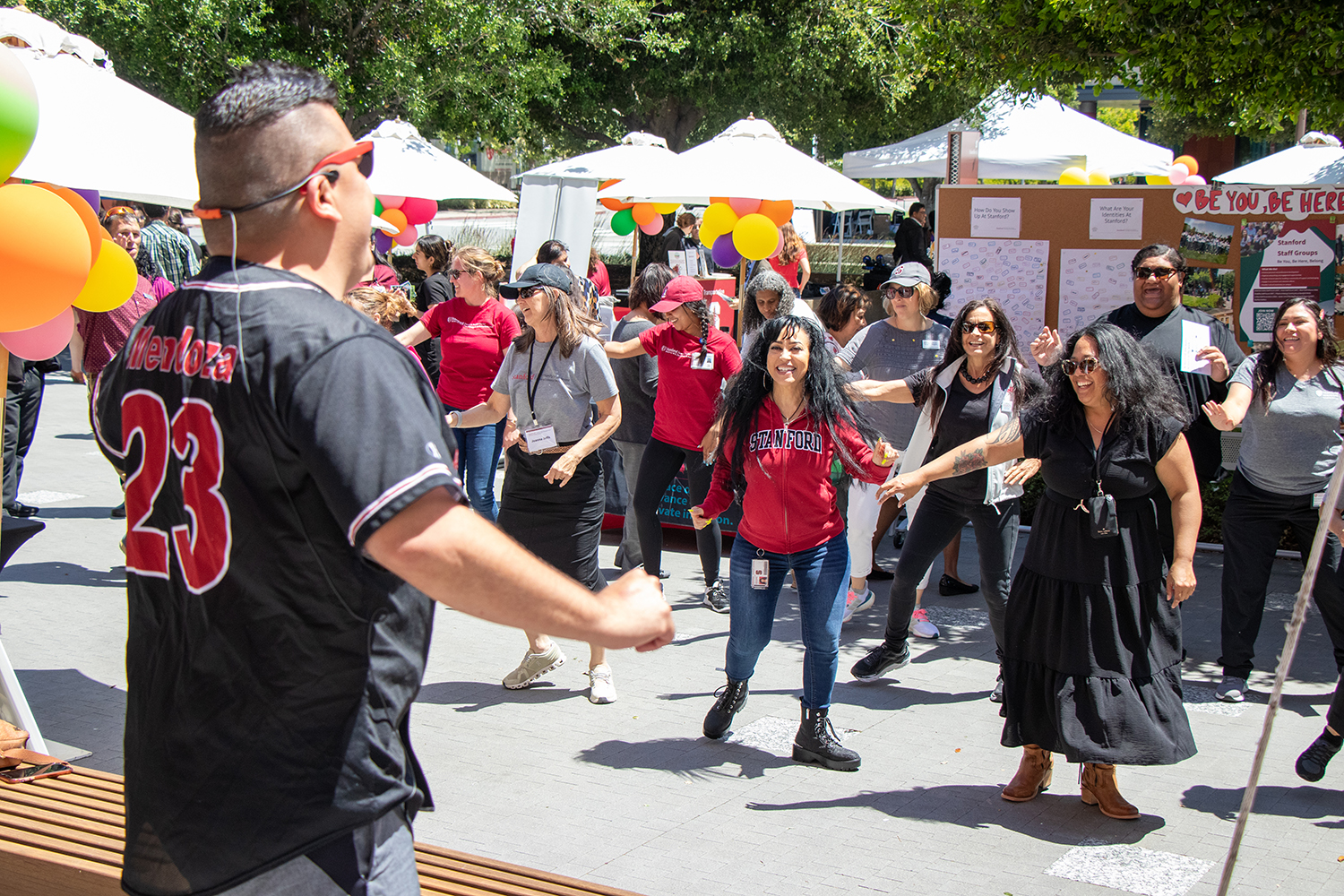 Pictured are staff members of the Redwood City Campus enjoying a performance.