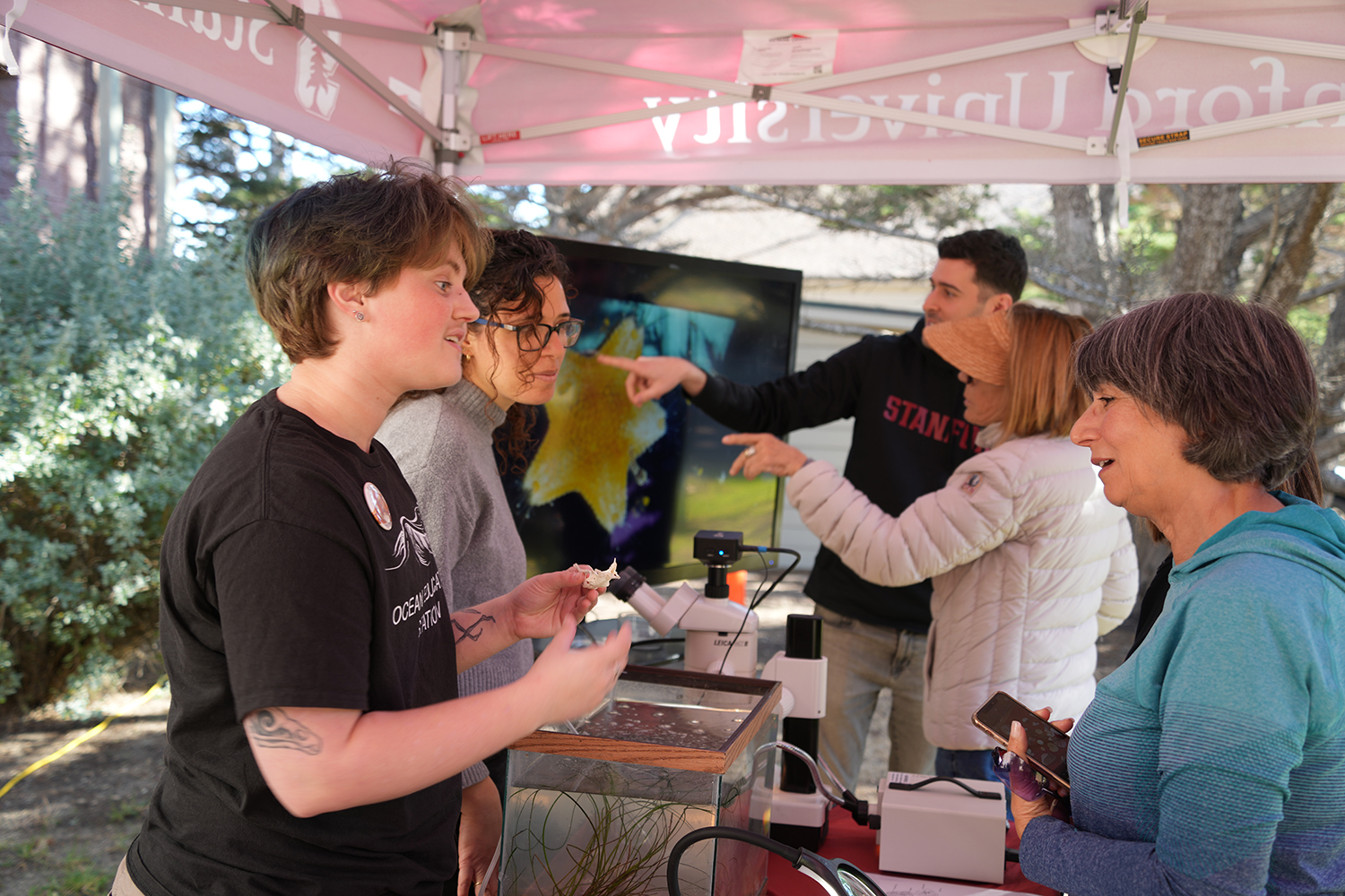 Vistors and educators talk at a popup ocean outreach event. 