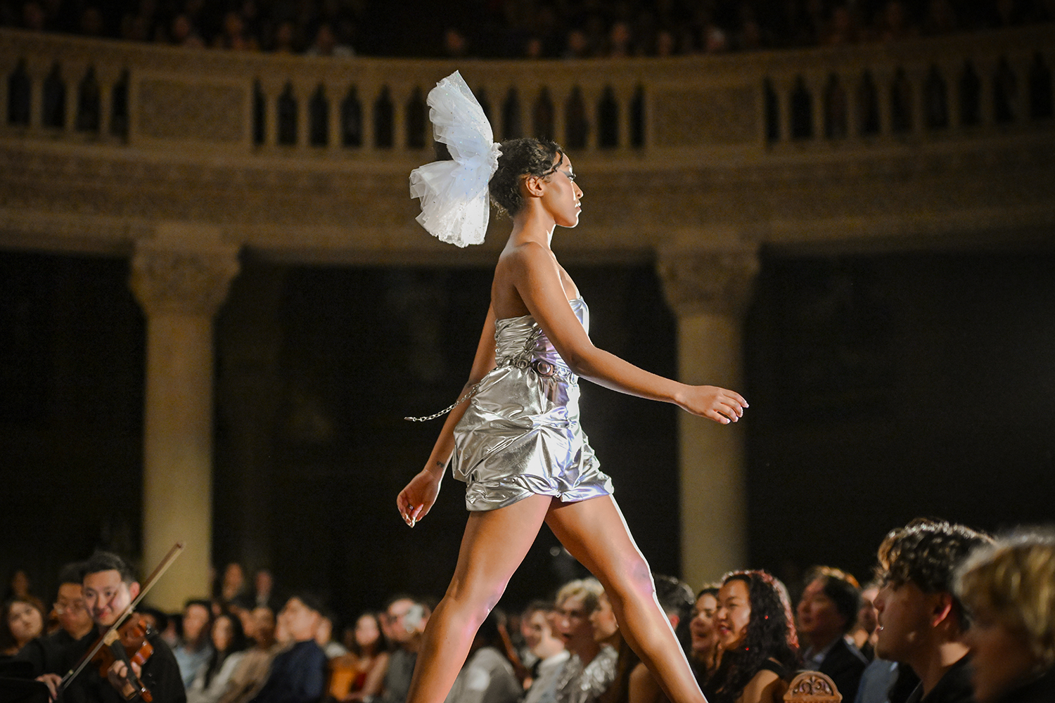 Student model walking down a runway.