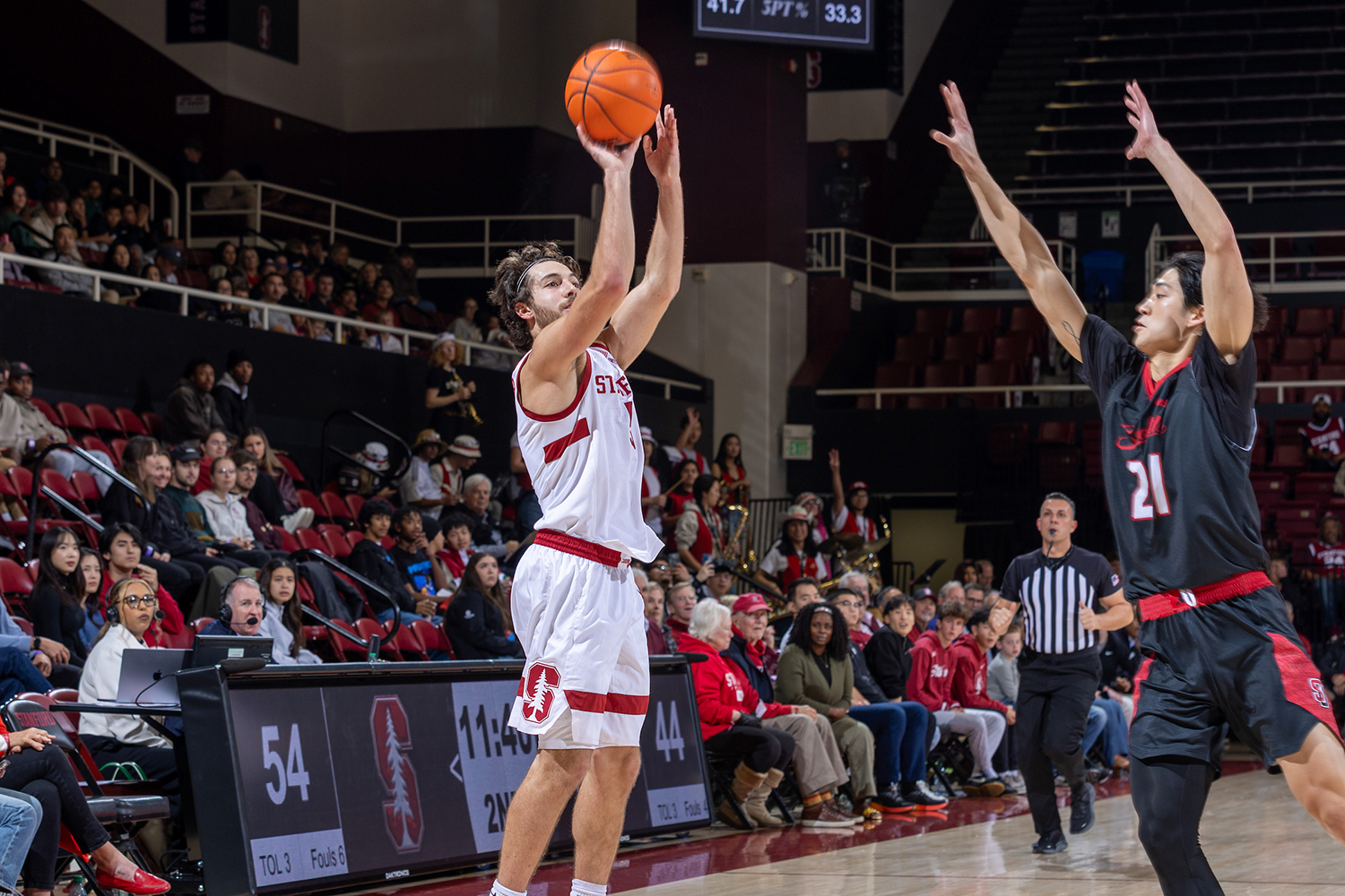 Image of Image of a Cardinal women's basketball player shooting the ball at the hoop.