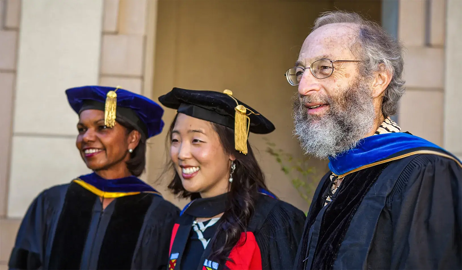 Image of Condoleezza Rice, Cecilia Mo, and Jonathan Bendor at a graduation ceremony.