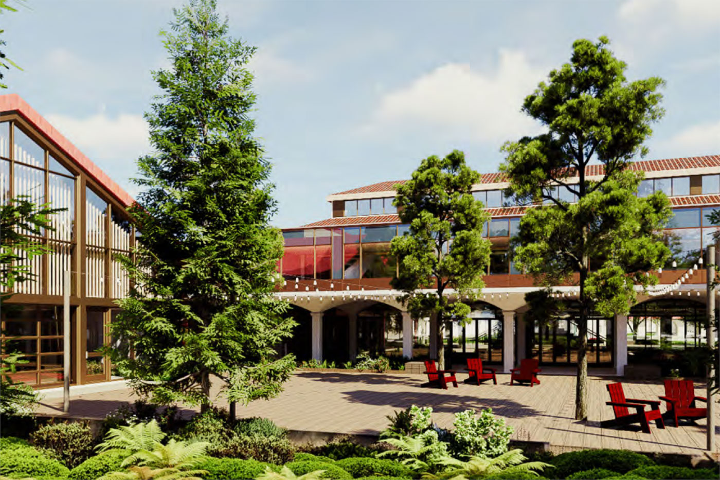 Paved courtyard with red chairs and mature trees surrounded by buildings with tiled roofs.