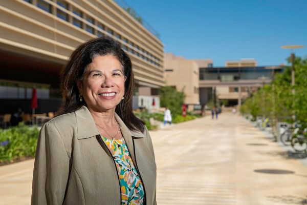 Yvonne Maldonado in front of a building on the Stanford campus