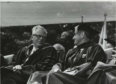 Kenneth Pitzer at his inauguration seated next to a university trusee