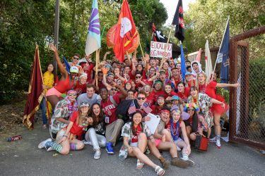A group of admits and student hosts pose for a photo at Frost Amphitheater