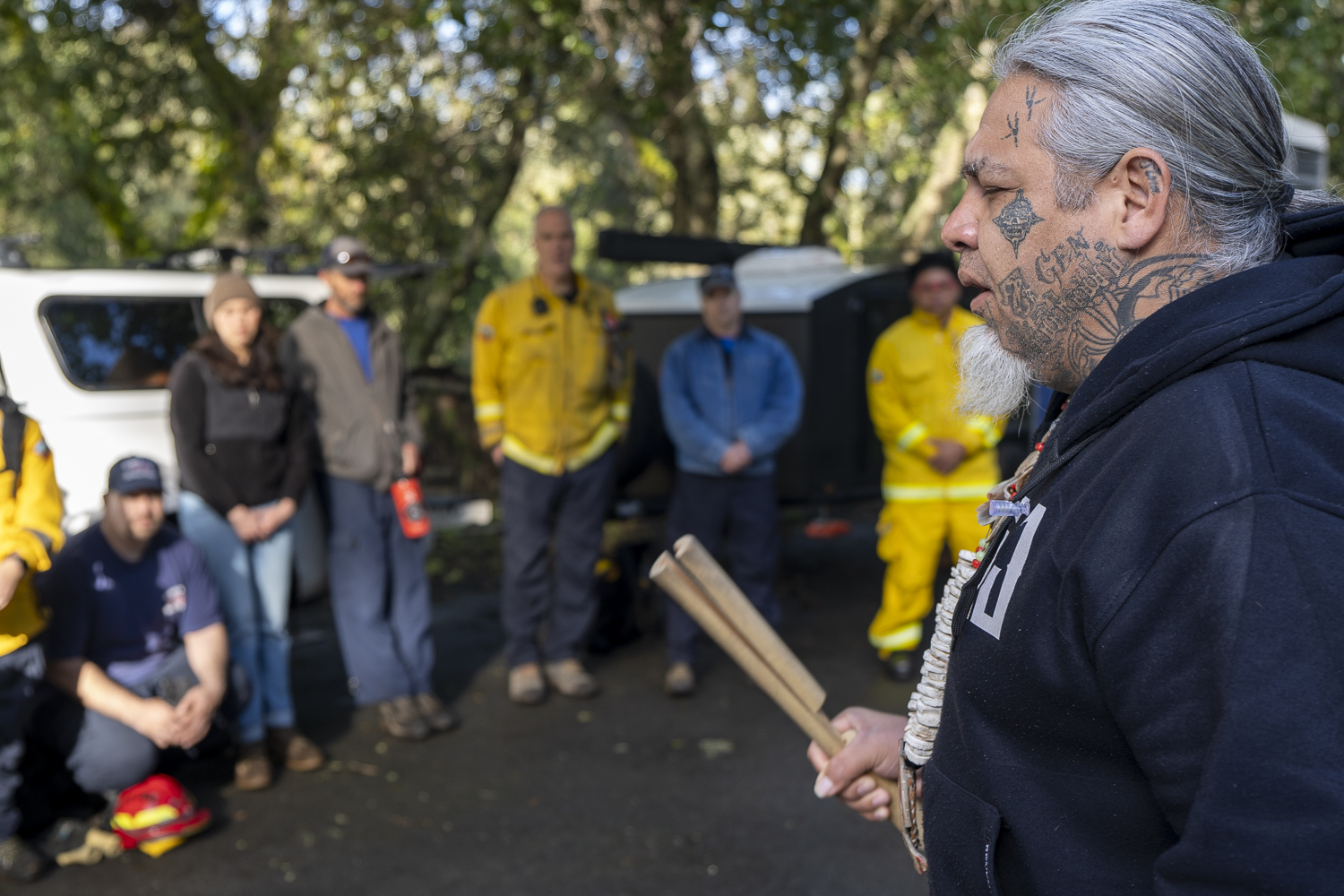 Joey Iyolopixtli Torres provides a blessing for firefighters.