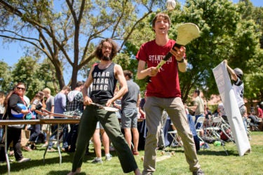 Isaac Caswell and Matt Mistele demonstrate hurling at the Activities Fair