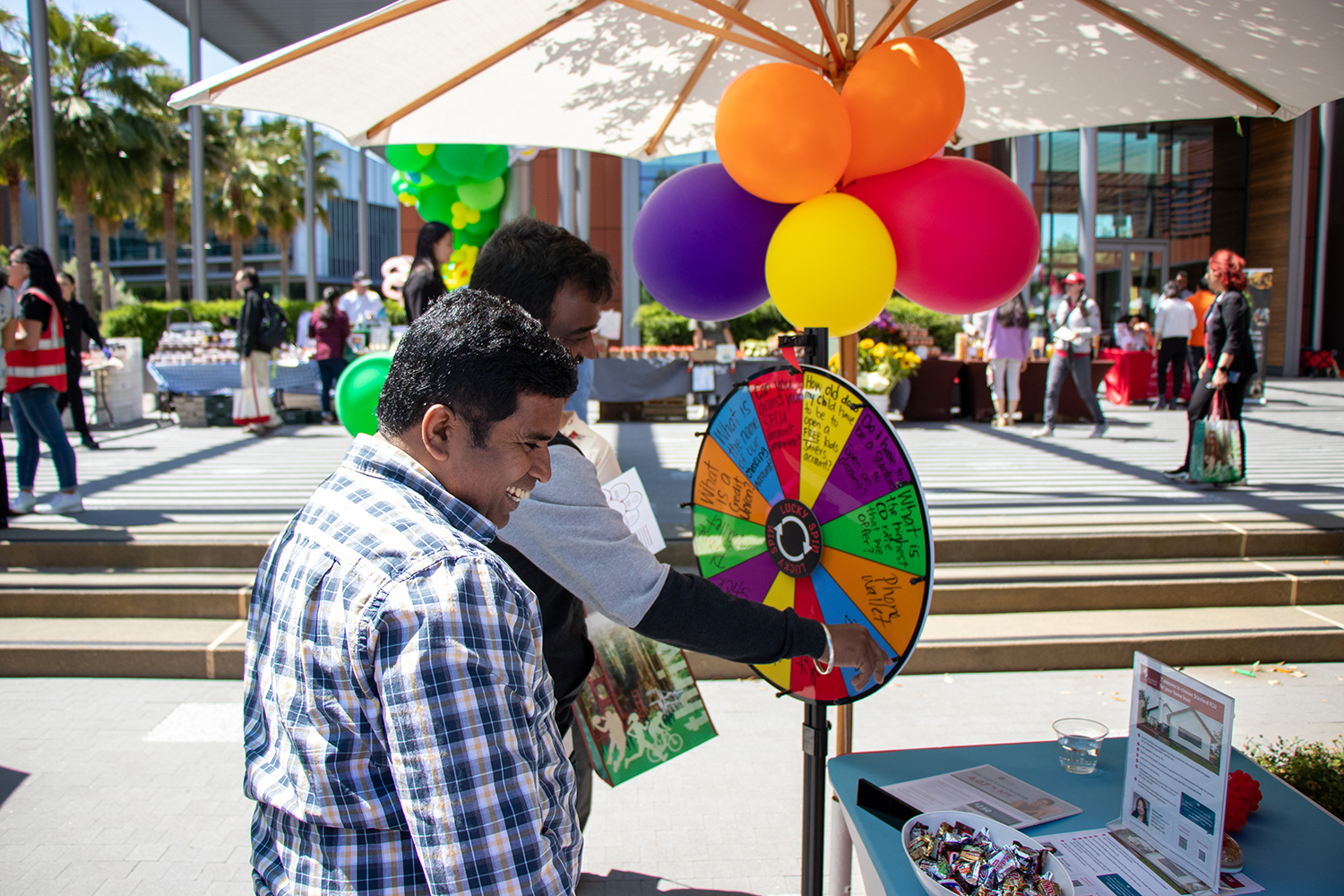 Staff at the Redwood City Campus check out some of the booths available.