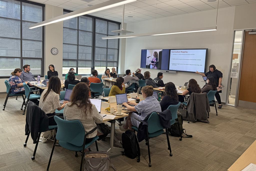 Image of people attending a workshop on the Stanford campus.