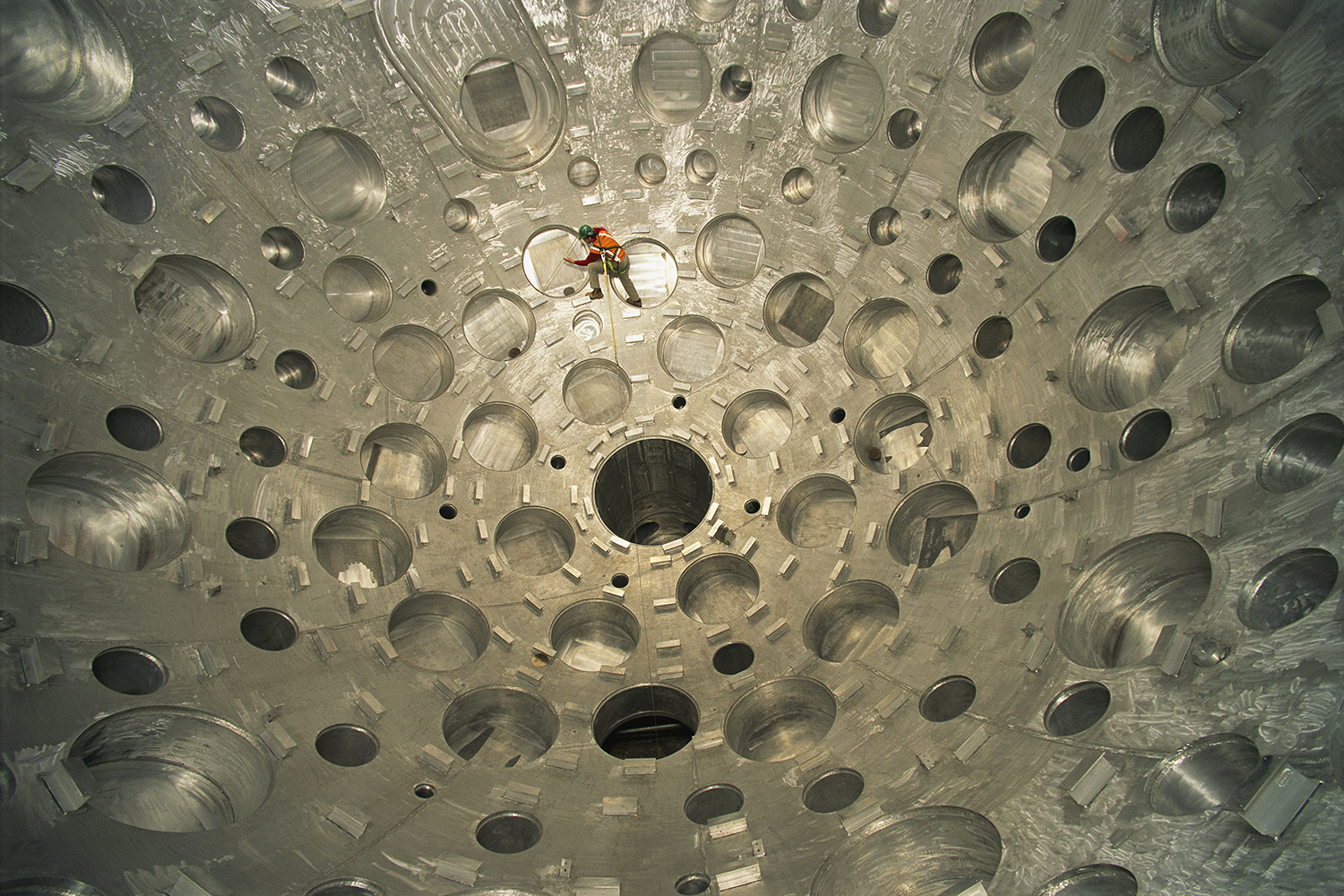 Worker inspects a target chamber at the National Ignition Facility in California.