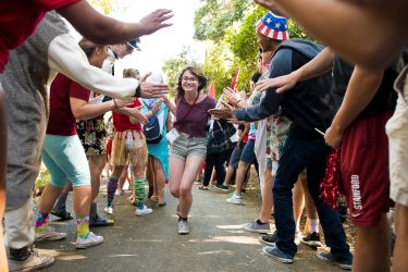 Admit runs gantlet of cheering student volunteers