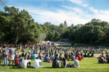 admits sitting on the grass in Frost Amphitheater