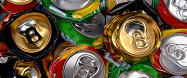 Close up photo of many crushed soda cans